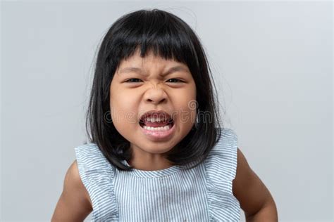 Portrait Of Angry Emotional Asian Girl Screaming And Frustrated