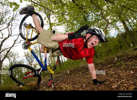 Young Man Falling Off Of Bicycle Dramatically Stock Photo Alamy