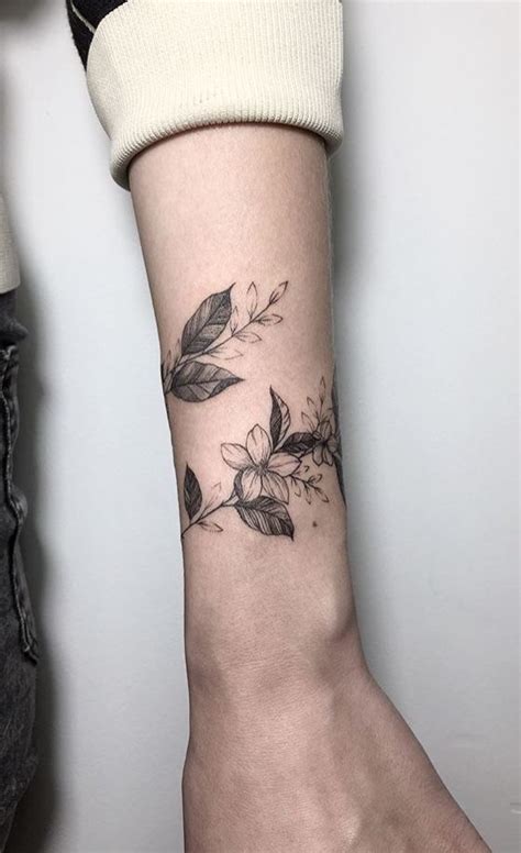Cute Feminine Flower Armband Tattoo On Wrist Tattoo Designs For Women
