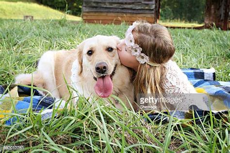 Girl Kissing Dog Stock Fotos Und Bilder Getty Images