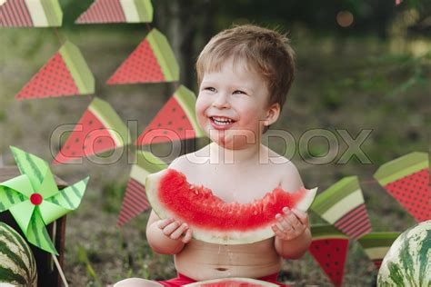 Baby Blond Boy Eats A Watermelon And Stock Image Colourbox