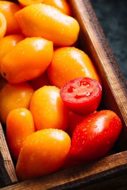 Free Photo Close Up Orange And Red Small Tomatoes