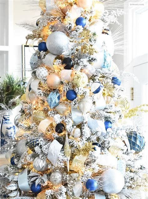 Beautiful Flocked Christmas Tree Adorned With Navy Light Blue And