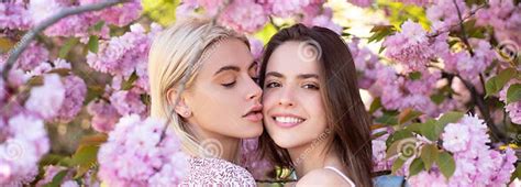 Spring Banner With Women Girlfriends Outdoor Spring Girls Lesbian Couple Kissing Beautiful