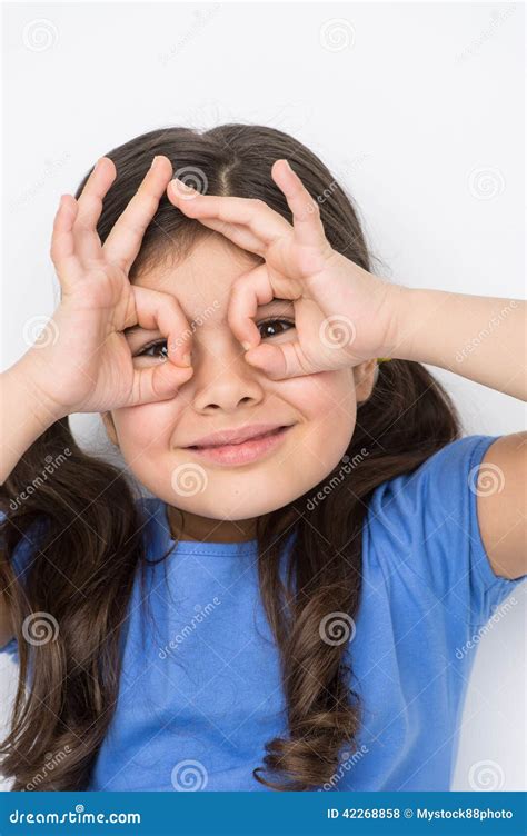 Nice Little Girl Gesturing And Playing Stock Photo Image Of