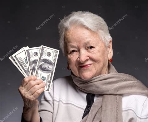 Old Woman Holding Money In Hands — Stock Photo © Vbaleha 42866115