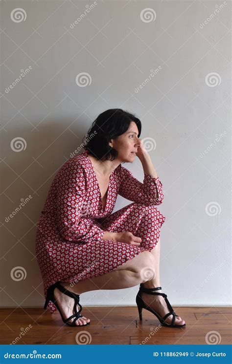 Woman Sitting Squatting In Front Of Ura Wall Stock Image Image Of
