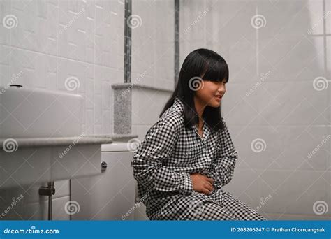 Asian Girl Sitting In Toilet And Suffering From Stomachache Stock Image Image Of Fast Giving