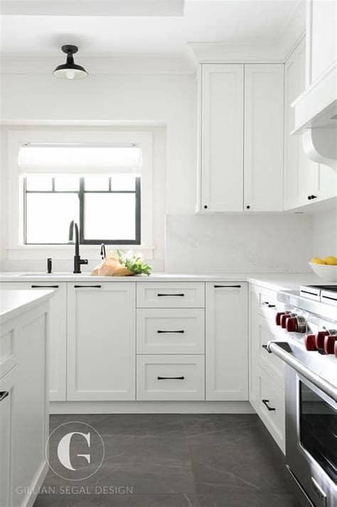 How to replace kitchen cabinets. Gray tiles cover the floors of this beautiful black and ...