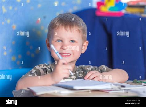 Preschool Smiling Boy Learning To Write Literacy Stock Photo Alamy