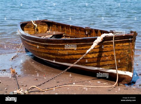 Old Wooden Rowing Boat On Beach Stock Photo Alamy