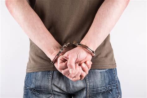 Hands In Handcuffs Free Stock Photo - Public Domain Pictures