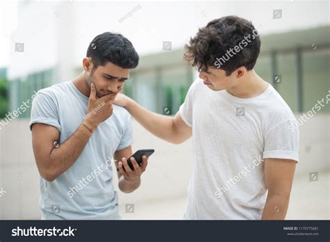 Disappointed Indian Guy Receiving Bad News Stock Photo 1179775681