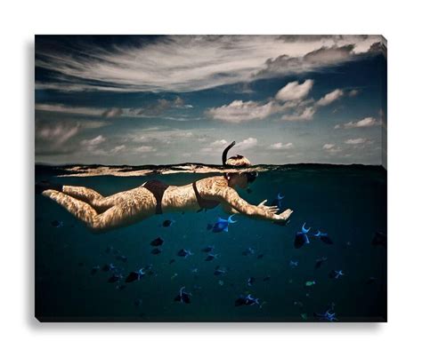 A color photograph of a woman snorkeling in the Indian Ocean. Photograph by RJW. Gallery wrapped ...