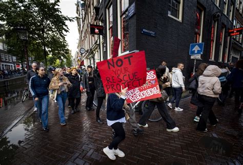 amsterdam sex workers protest against planned relocation of red light district brussels signal