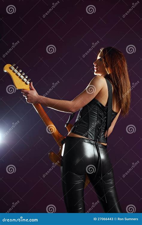 Sexy Guitar Player Over Purple Background Stock Photos Image