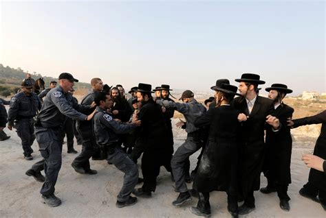 Intense Photos Of Ultra Orthodox Protestors Fighting Israeli Settlement
