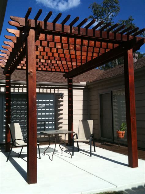 Rustic Outdoor Pergola And Stained Concrete Patio By The Western Patio
