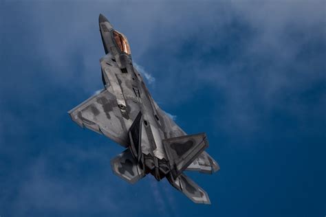 An F 22 Raptor Aircraft Performs A Tail Slide Maneuver During An