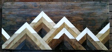 Due to the nature of the wood, we work with variations in cut, color, grain, and knots that will make each piece. 3D geometric Snow Topped Mountain Range on reclaimed wood ...