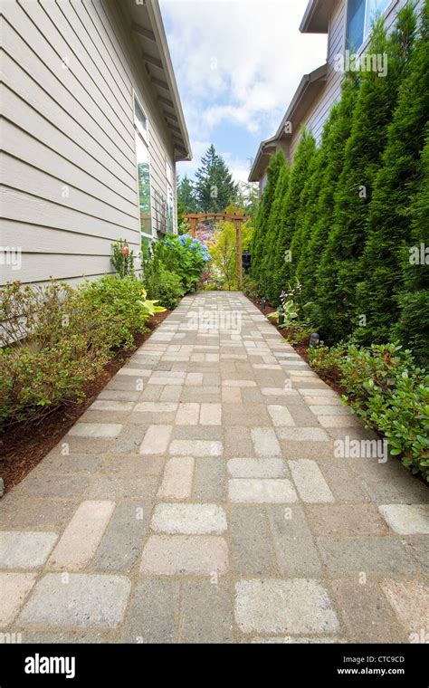 Garden Pavers Path Walkway With Landscaping Lights And Arbor Stock