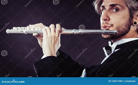 Elegantly Dressed Male Musician Playing Flute Stock Image Image Of