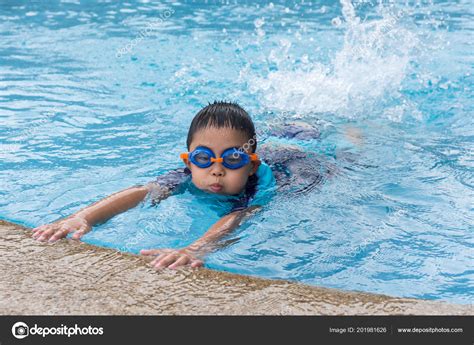 Young Boy Swimming Pool Stock Photo By ©zenstock 201981626