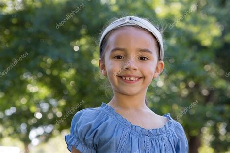 Happy Little Girl Smiling Stock Photo By ©wavebreakmedia 69004093