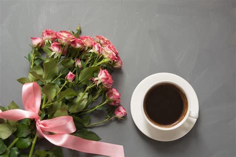 Bouquet Of Pink Roses And Cup Of Coffee On Gray Premium Photo