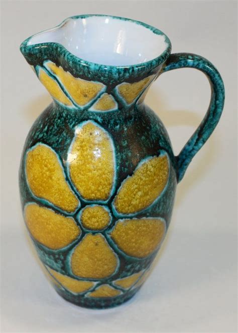 It has a beautiful satin periwinkle blue glaze with blue and red highlights. Vintage Italy Ceramic Pitcher Flower Design Glazed Signed ...