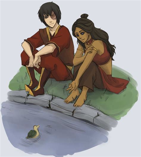 Two People Sitting On The Ground Next To A Body Of Water With A Duck In It