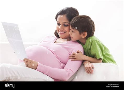 Pregnant Mother And Son Looking At Ultrasound Scans Stock Photo Alamy