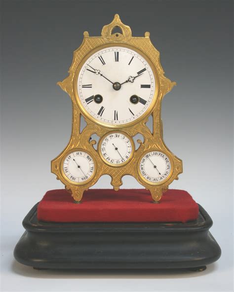 A Late 19th Century French Gilt Brass Calendar Clock With Eight Day