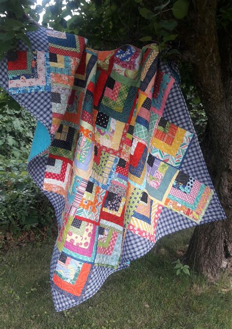 Each cloth also is a useful finished object in its own right. Em's Scrapbag: Scrappy Quarter Log Cabin Finish