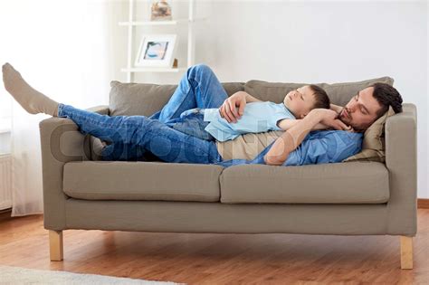 Happy Father And Son Sleeping On Sofa At Home Stock Image Colourbox