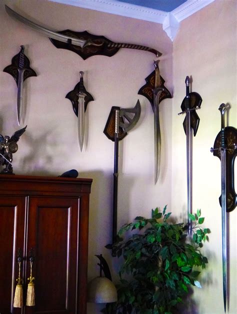 This is the first book of tolkiens trilogy the lord of the rings. Swords Display Ideas / Lord of the rings / Home office ...