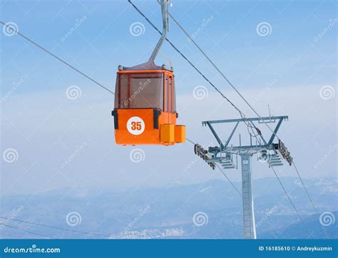Ski Lift Cable Ropeway And Cableway Transport System For Skiers With Fog On Valley Background