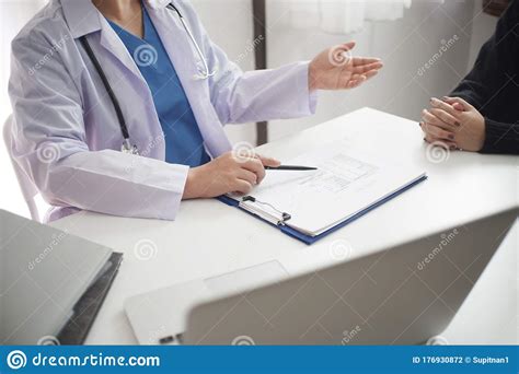 Female Medicine Doctor Working On Table With Consulting