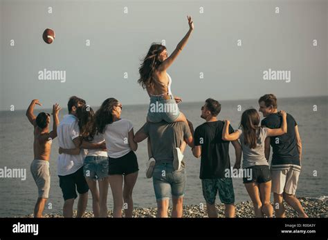 Happy Mans And Womans Walk At The Beach Group Of Friends Enjoying Beach Holidays Stock Photo Alamy