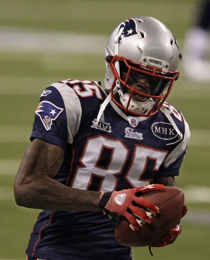 New England Patriots Wide Receiver Chad Ochocinco Warms Up On The Field