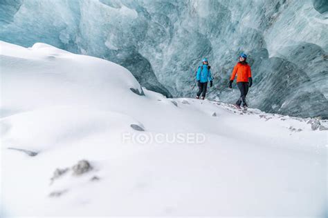 Friends Exploring Frozen Ice Caves In Alberta — Age Jasper Stock