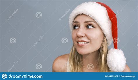 Dreamy Smiling Santa Girl Wearing Red Hat Looking Side Up Portrait Of