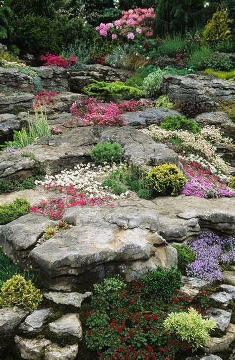 When designing a rock garden, you can be creative and achieve a perfect balance of the artistic and the sustainable as demonstrated by this alluring creation by add height to a rock garden planting design using low, wide containers filled with colorful annuals you can change through the seasons. Easy Rock Garden Designs | Rock garden landscaping, Rock ...