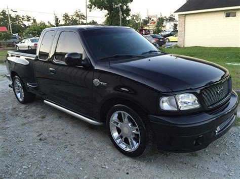 Extended cab pickup with a leer bed hard topper. 2000 Ford f150 harley davidson $15,000 - 100670537 ...