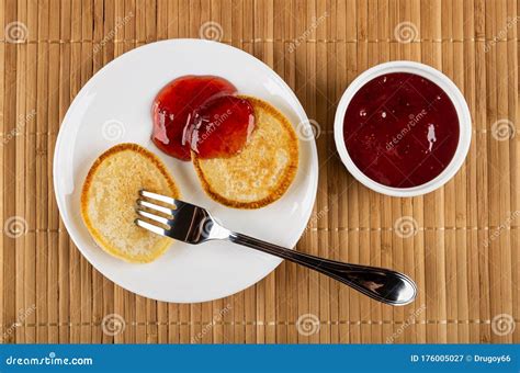 Pancake On Fork Pancake Poured Jam In Saucer Bowl With Strawberry Jam