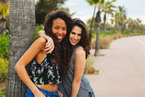 Portrait Of A Young Multiethnic Female Friends Outdoors In Summer By Stocksy Contributor