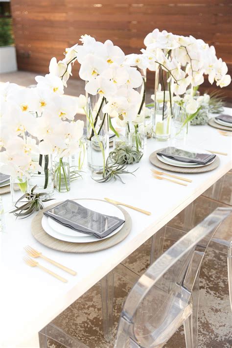 Modern Wedding Table Setting With Cascading Orchids Centerpiece