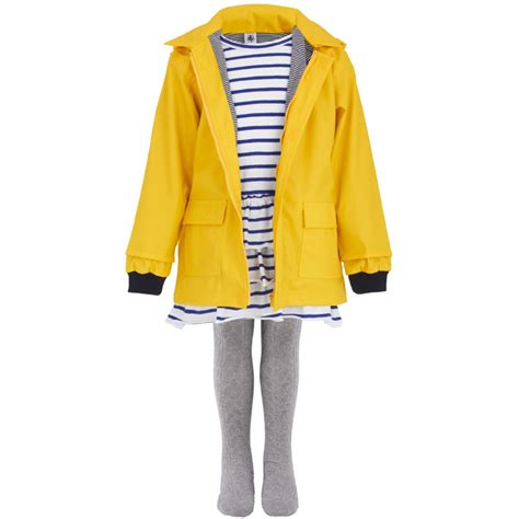 Teenager fisherman boy wearing yellow raincoat over isolated background showing and pointing up with fingers number ten while smiling confident and happy. Petit Bateau Chartreuse Yellow Classic Raincoat | AlexandAlexa