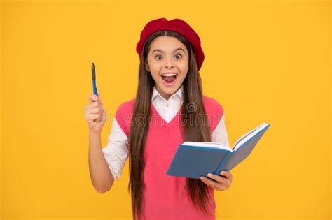 Happy Teen School Girl In French Beret Making Notes In Notepad Inspired With Idea Inspiration