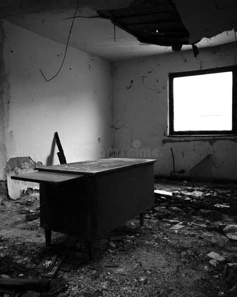 A Messy Room With An Old Desk And A Dilapidated Ceiling In An Abandoned